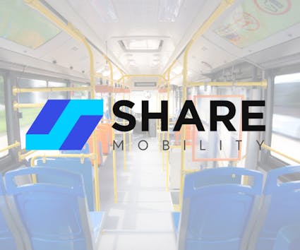 solon-share-mobility The Share Mobility logo over a photo the inside of a bus